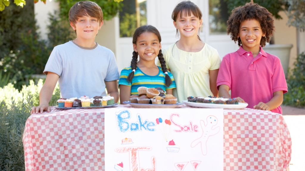 Kids running a bake sale to raise funds to help clean water charities